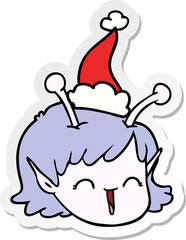 hand drawn sticker cartoon of a alien space girl face wearing santa hat