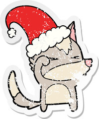 distressed sticker of a tired wolf cartoon wearing xmas hat