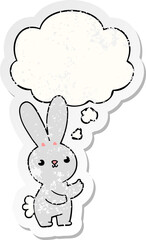 cute cartoon rabbit with thought bubble as a distressed worn sticker
