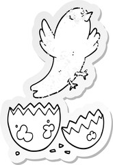 distressed sticker of a cartoon bird hatching from egg