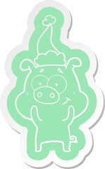 happy quirky cartoon  sticker of a pig wearing santa hat