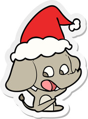 cute hand drawn sticker cartoon of a elephant wearing santa hat