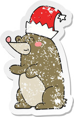 retro distressed sticker of a cartoon bear wearing christmas hat