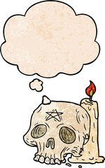cartoon spooky skull and candle with thought bubble in grunge texture style