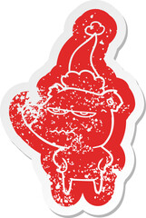 angry bear polar quirky cartoon distressed sticker of a wearing santa hat