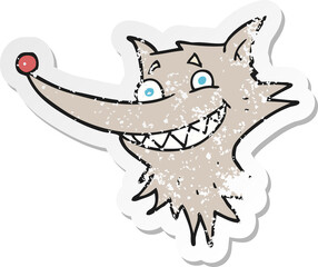 retro distressed sticker of a cartoon grinning wolf face
