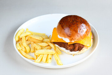 Big tasty burger with beef cutlet on a plate