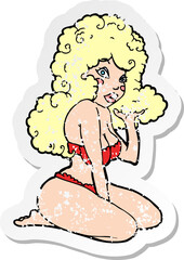 retro distressed sticker of a cartoon pin up girl