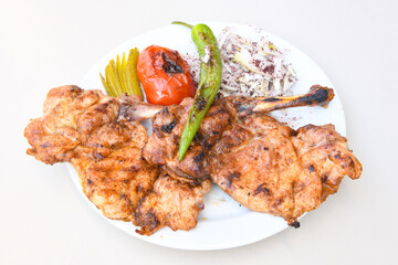 Chicken wings barbeque in a dish with BBQ grill sauce . Izgara tavuk kelebek sis kanat. Tavuk sis, gogus.