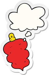 cartoon christmas bauble with thought bubble as a printed sticker