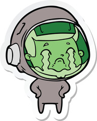 sticker of a cartoon crying astronaut