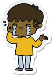 sticker of a cartoon boy crying