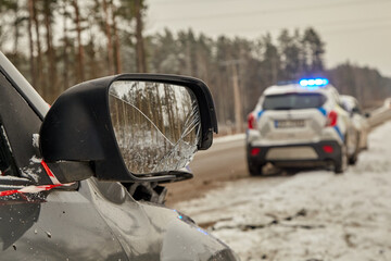 Right side mirror of a car after accident on a road