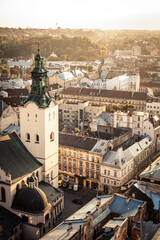 Obraz premium Panorama of Lviv Ukraine. Image of an old Ukrainian city on a sunny day from a bird's eye view. Photos about travel and ancient architecture.