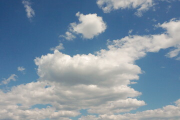 Fototapeta na wymiar White Clouds on Bright Blue Sky