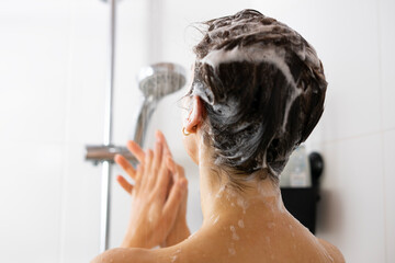 girl showering. Girl lathering her hair
