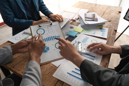 Business people meeting together on finance topics, they are working together to plan and solve corporate finance issues. Concept of business administration and finance