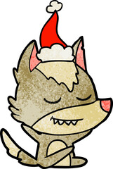 friendly hand drawn textured cartoon of a wolf sitting wearing santa hat