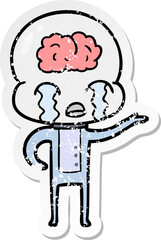 distressed sticker of a cartoon big brain alien crying