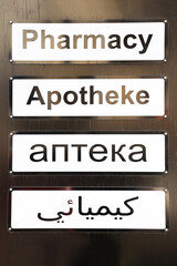 Pharmacy. Pharmacy sign in different languages.