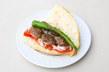 Meatball between bread (Turkish name : ekmek arasi kofte ) Izgara kofte. Manisa, Akcaabat, Akhisar  kofte