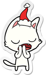 talking cat hand drawn sticker cartoon of a wearing santa hat