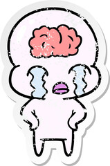 distressed sticker of a cartoon big brain alien crying