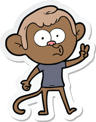 sticker of a cartoon hooting monkey