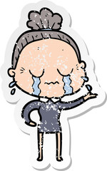 distressed sticker of a cartoon crying old lady