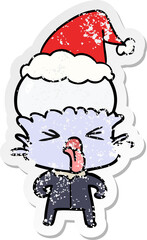 weird hand drawn distressed sticker cartoon of a alien wearing santa hat