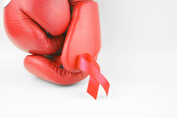 Red ribbon with boxing gloves, wrestling symbol.