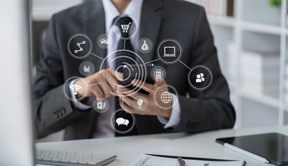 Businessman using mobile phone play social in office.