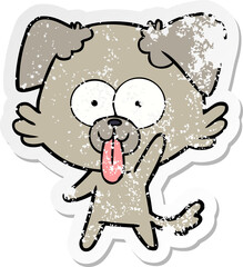 distressed sticker of a cartoon dog with tongue sticking out