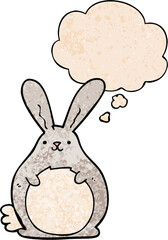cartoon rabbit with thought bubble in grunge texture style