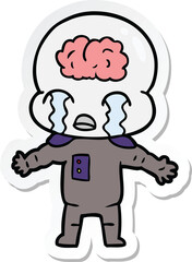 sticker of a cartoon big brain alien crying