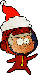 happy astronaut hand drawn textured cartoon of a wearing santa hat