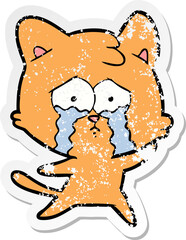 distressed sticker of a cartoon crying cat