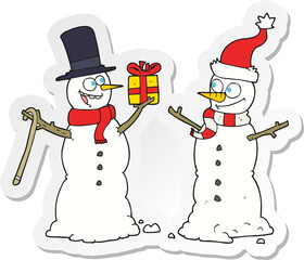 sticker of a cartoon snowmen exchanging gifts