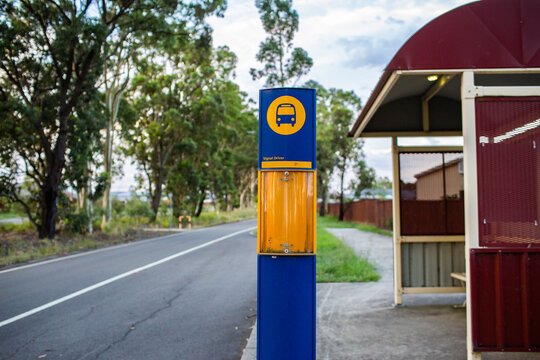 Bus Stop Shelter Beside Road With Green Strip