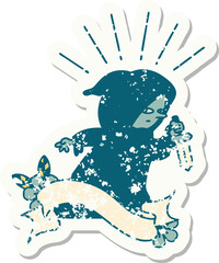 worn old sticker of a tattoo style assassin with knife