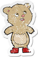 retro distressed sticker of a cartoon teddy bear