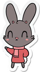 Fototapeta na wymiar sticker of a cute cartoon rabbit wearing clothes