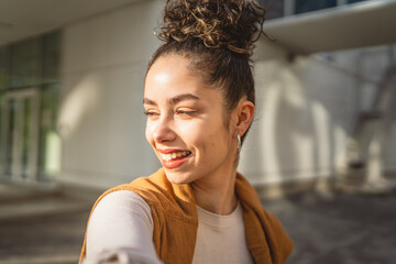 self portrait selfie young Caucasian woman stand outdoor happy smile