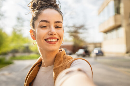 self portrait selfie young Caucasian woman stand outdoor happy smile