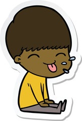 sticker of a cartoon boy sticking out tongue