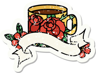 worn old sticker with banner of a cup and flowers