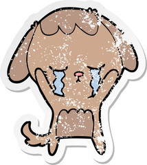 distressed sticker of a cartoon dog crying