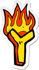 sticker of a cartoon flaming letter