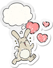 cartoon rabbit in love with thought bubble as a distressed worn sticker