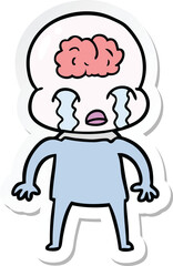 sticker of a cartoon big brain alien crying